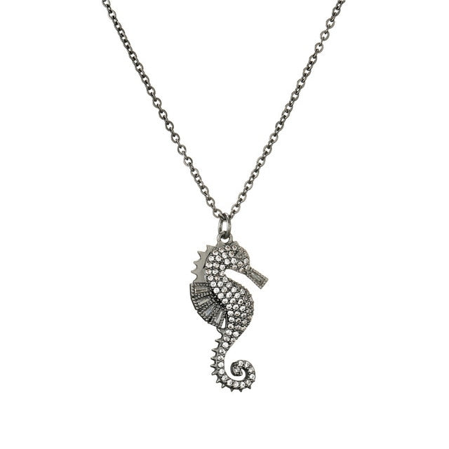 Sea horse and synthetic coral bead on gold-coloured sterling silver necklace  | Laval Europe